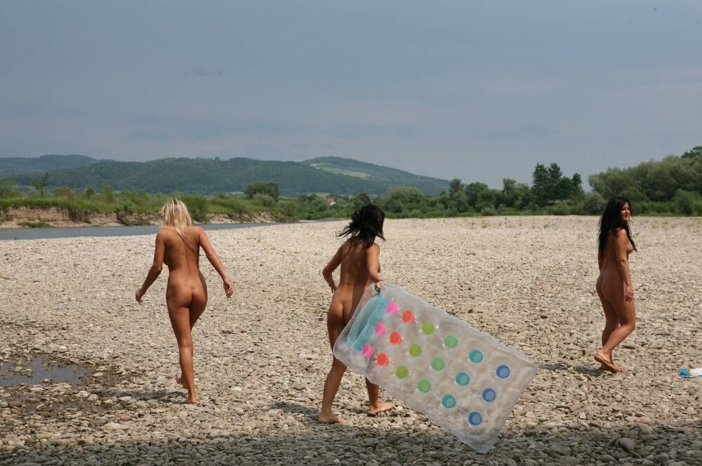 Naturist Park Floating On River photos - She appeared completely naked