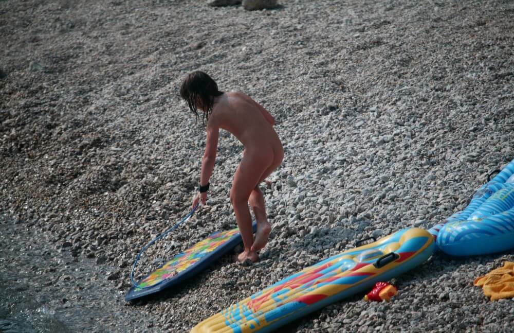 Naturist Surf Board Glides pics - Undressing is permissible only within ones own community