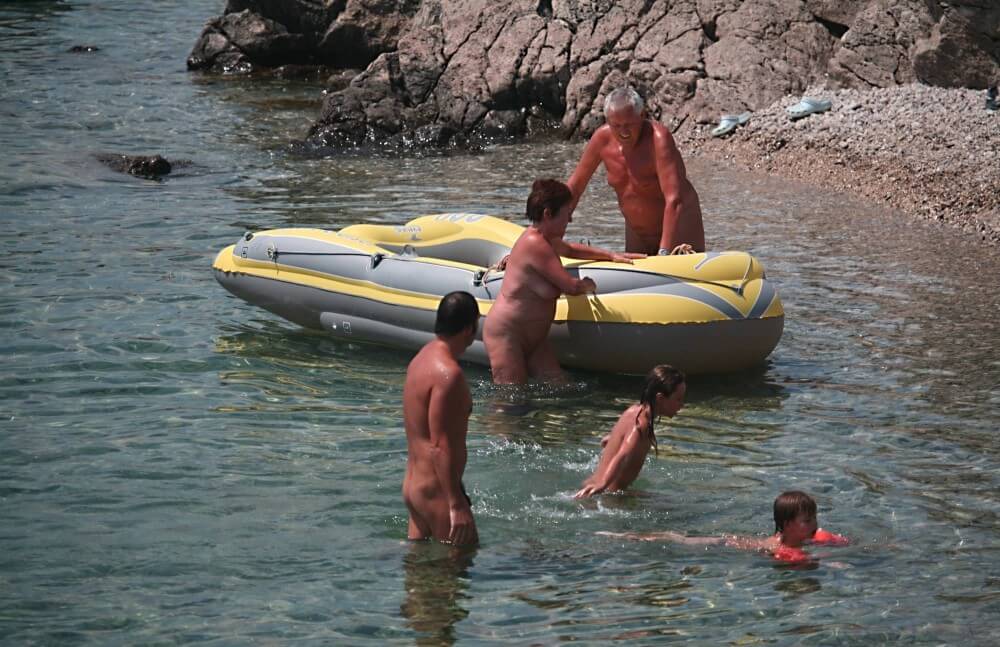 Lone Nudist in Yellow Boat photos - The body is a reflection of inner beauty and harmony in naturism and nudism