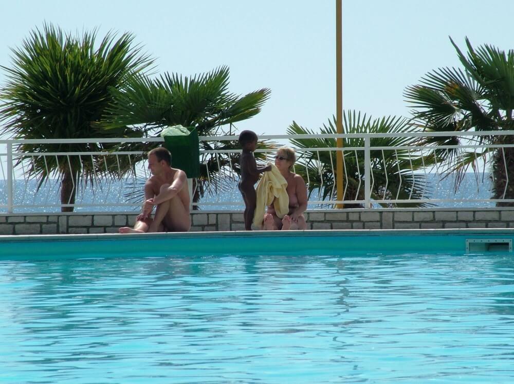 Photo of naturists in an outdoor pool - Nudity helps you understand yourself and the people around you better