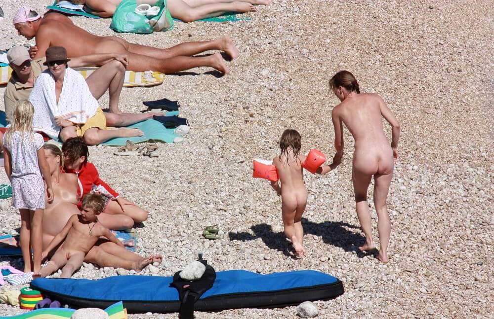 Orange Floaty Safety First Naturist pics - People come together in unity with nature to take off their clothes